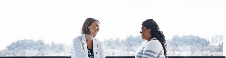 actor portrayal of female doctor speaking with female patient