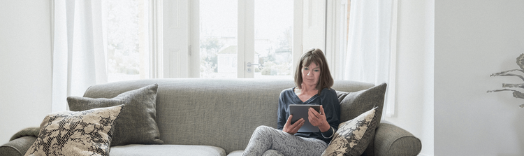 Woman reading on couch