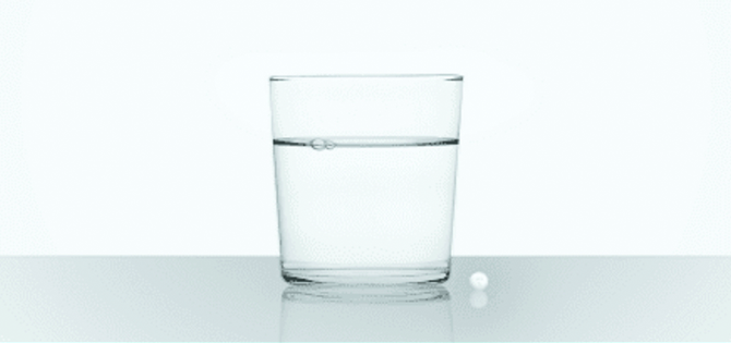 glass of water with pill