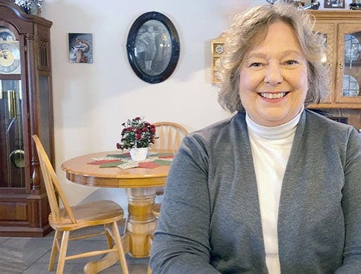 real patient Ronda in kitchen smiling