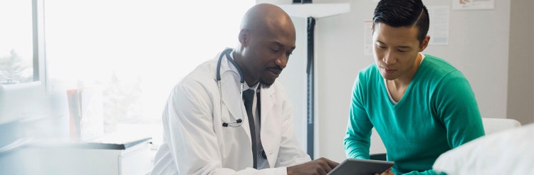 actor portrayal of male doctor explaining results to male patient
